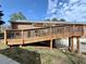 Exterior shot of a home with a wooden deck that leads to the backyard at 248 Arnold Ave, Marietta, GA 30066