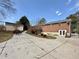 Exterior shot of the backyard showcasing the patio, deck, home, and detached garage at 248 Arnold Ave, Marietta, GA 30066