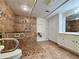 Bathroom with a walk-in shower and safety bars, as well as updated vanities and tiled flooring at 248 Arnold Ave, Marietta, GA 30066