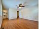 Comfortable bedroom with wood-look floors, ceiling fan and ensuite bathroom at 248 Arnold Ave, Marietta, GA 30066