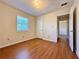 Bedroom with wood-look floors and access to hallway and closet at 248 Arnold Ave, Marietta, GA 30066