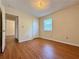 Bedroom with wood-look floors and access to the closet at 248 Arnold Ave, Marietta, GA 30066