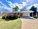 Charming brick ranch home with a covered parking area and well-maintained front lawn at 248 Arnold Ave, Marietta, GA 30066