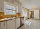 Well-lit kitchen features stainless steel appliances, double bowl sink, and bright windows at 248 Arnold Ave, Marietta, GA 30066