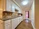 Functional kitchenette features neutral countertops, white cabinets, backsplash and essential appliances for convenient meal preparation at 248 Arnold Ave, Marietta, GA 30066