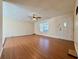 Inviting living room featuring durable wood laminate flooring, ceiling fan, and a bright front door at 248 Arnold Ave, Marietta, GA 30066