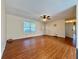 Comfortable living room featuring durable wood laminate flooring, ceiling fan, and front entry at 248 Arnold Ave, Marietta, GA 30066