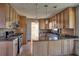 Modern kitchen featuring granite countertops, stainless steel appliances, and wood cabinetry at 3572 Dexter Way, Marietta, GA 30062