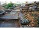 Stone steps lead through a terraced garden with rock walls and flowering plants at 3572 Dexter Way, Marietta, GA 30062