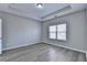 Bedroom featuring a large window, recessed lights, and a tray ceiling at 68 Hardy Water Dr, Lawrenceville, GA 30045