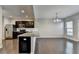 Modern kitchen with stainless steel appliances, granite countertops and hardwood flooring at 68 Hardy Water Dr, Lawrenceville, GA 30045