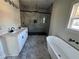 Bathroom with dual vanities, soaking tub, and spacious glass enclosed shower at 1510 Olympian Sw Way, Atlanta, GA 30310