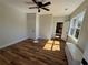 Bedroom featuring hardwood floors, neutral paint, and abundant sunlight at 1510 Olympian Sw Way, Atlanta, GA 30310