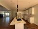 Modern kitchen featuring a center island, new white cabinets, and stainless-steel appliances at 1510 Olympian Sw Way, Atlanta, GA 30310