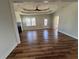 Spacious living room featuring a decorative ceiling, hardwood floors, and lots of natural light at 1510 Olympian Sw Way, Atlanta, GA 30310
