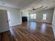 Bright living area featuring an elegant ceiling design, hardwood floors, and a decorative fireplace at 1510 Olympian Sw Way, Atlanta, GA 30310