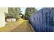 Spacious, fenced in backyard with gazebo, trees, and lawn at 3897 Vine Stone Dr, Stonecrest, GA 30038