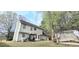 The backyard features a patio with outdoor seating and a well-maintained lawn at 3897 Vine Stone Dr, Stonecrest, GA 30038