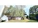 Outdoor patio with seating area, gazebo, and lush trees at 3897 Vine Stone Dr, Stonecrest, GA 30038