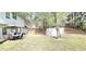 Backyard with a patio seating area for outdoor dining and a gazebo at 3897 Vine Stone Dr, Stonecrest, GA 30038