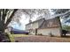 The backyard features a patio with outdoor seating and a well-maintained lawn at 3897 Vine Stone Dr, Stonecrest, GA 30038