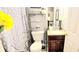 Small but functional bathroom with granite vanity and decorative shower curtain at 3897 Vine Stone Dr, Stonecrest, GA 30038