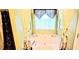 Large soaking tub enclosed by decorative curtains and window at 3897 Vine Stone Dr, Stonecrest, GA 30038