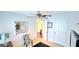 Neutral bedroom with a fan, a mirror art piece, and an open doorway to the rest of the home at 3897 Vine Stone Dr, Stonecrest, GA 30038
