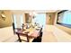 The dining room displays a large table set with decorative accents and crown molding at 3897 Vine Stone Dr, Stonecrest, GA 30038