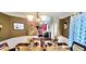 The dining room displays an elegant chandelier and decor for sophisticated dining at 3897 Vine Stone Dr, Stonecrest, GA 30038