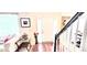 Welcoming foyer with hardwood floors, white front door, and view of the staircase and living room at 3897 Vine Stone Dr, Stonecrest, GA 30038