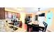 Bright kitchen with stainless steel appliances, granite counters and adjacent dining area at 3897 Vine Stone Dr, Stonecrest, GA 30038