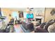 Cozy living room showcasing a fireplace, comfortable seating, and a ceiling fan for added comfort at 3897 Vine Stone Dr, Stonecrest, GA 30038