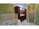 Bathroom with a large soaking tub, wood cabinets, and glass shower stall at 4473 Marjorie, Snellville, GA 30039