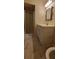 Cozy bathroom features a single vanity, decorative mirror, and shower, perfect for a home at 4473 Marjorie, Snellville, GA 30039