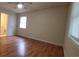 Comfortable bedroom with hardwood floors, large window, and ensuite bathroom at 4473 Marjorie, Snellville, GA 30039