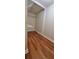 Walk-in closet with shelving and wood-look flooring, providing ample storage for clothes at 4473 Marjorie, Snellville, GA 30039