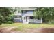 Charming two-story home with blue siding, covered front porch, and mature trees at 4473 Marjorie, Snellville, GA 30039