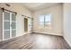 Spacious bedroom with wood floors, bright natural light, and a view of the city at 502 Pryor Sw St # 301, Atlanta, GA 30312