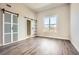 Bedroom with wood floors and a window that allows natural light, with access to a closet or bathroom through barn doors at 502 Pryor Sw St # 301, Atlanta, GA 30312