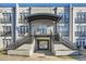 View of the building entrance with a covered entryway and black metal railings, offering a stylish welcome at 502 Pryor Sw St # 301, Atlanta, GA 30312