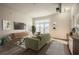 Bright living room featuring hardwood floors, balcony access, and contemporary furnishings at 502 Pryor Sw St # 301, Atlanta, GA 30312