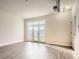 Spacious living room featuring balcony access and modern lighting fixtures at 502 Pryor Sw St # 301, Atlanta, GA 30312
