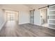 Hardwood floors throughout living space with sliding barn doors to closet and french doors to balcony at 502 Pryor Sw St # 301, Atlanta, GA 30312