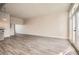 Open concept living space featuring balcony doors, hard wood flooring, and neutral paint colors at 502 Pryor Sw St # 301, Atlanta, GA 30312