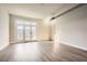 Bright living room featuring wood-look flooring and a door to a balcony that invites natural light at 502 Pryor Sw St # 301, Atlanta, GA 30312