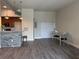Open-concept kitchen bar area with modern lighting and dining space at 502 Pryor Sw St # 301, Atlanta, GA 30312