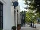 Street view of a white brick building with large windows, trees, and sidewalk with greenery at 502 Pryor Sw St # 301, Atlanta, GA 30312
