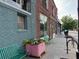 Inviting street view featuring a brick building with planter boxes and benches along the sidewalk at 502 Pryor Sw St # 301, Atlanta, GA 30312