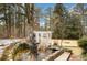 Picturesque water feature includes a pond, statue and charming garden structure at 813 Sandy Creek Rd, Fayetteville, GA 30214